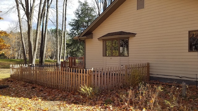 view of property exterior with fence