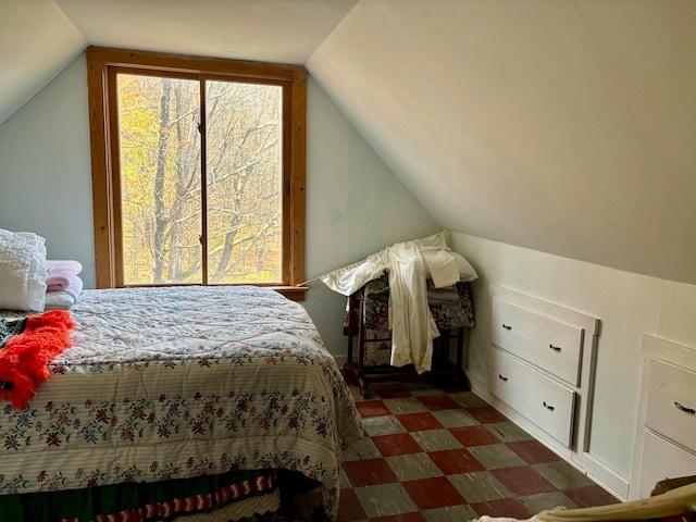 bedroom featuring lofted ceiling