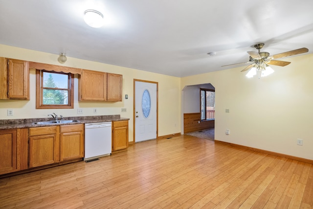 kitchen featuring light hardwood / wood-style floors, sink, white dishwasher, and ceiling fan