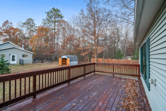 wooden deck with a storage shed