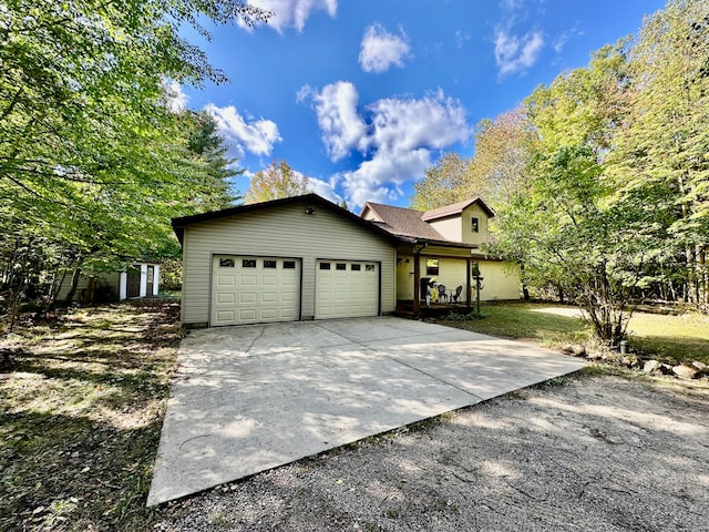 view of front of home with a garage and a front yard