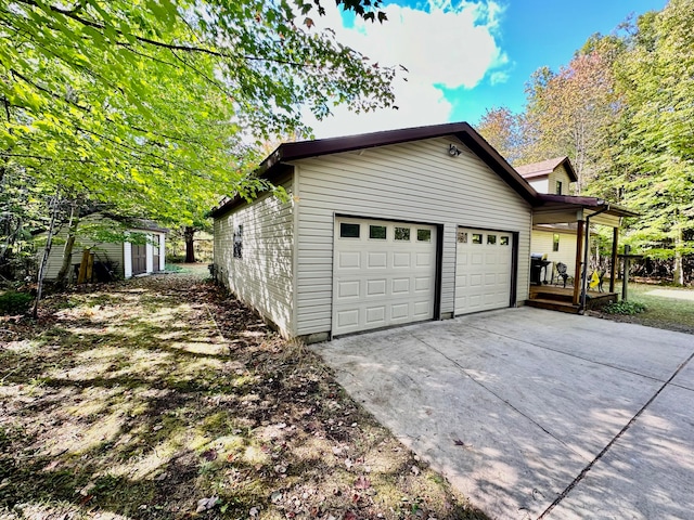 view of home's exterior with a storage shed and a garage