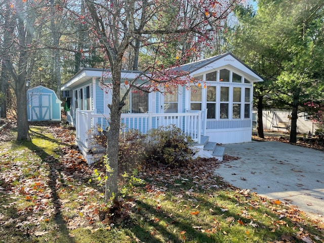 exterior space featuring a shed