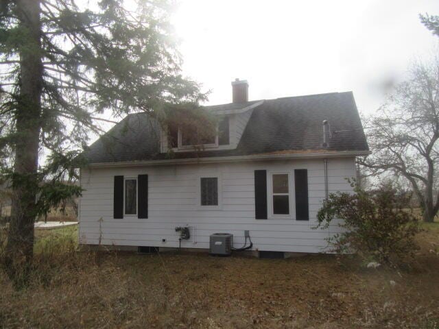 back of property with central air condition unit