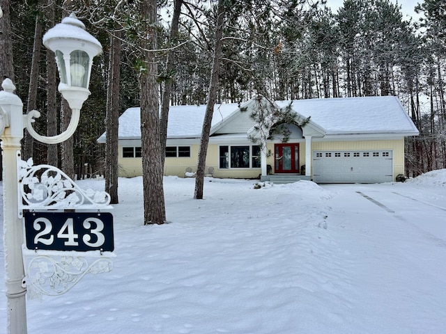 single story home featuring a garage