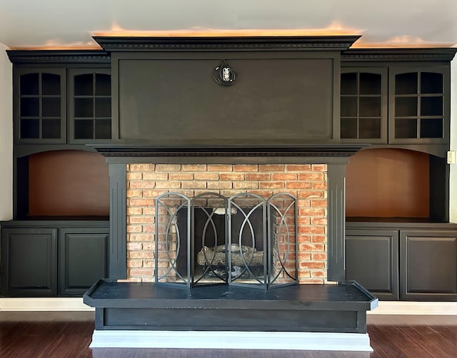 room details with hardwood / wood-style flooring and a brick fireplace