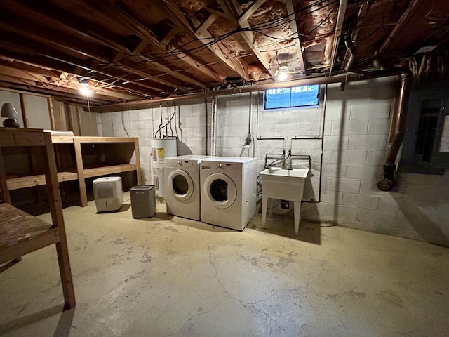 washroom with washing machine and dryer, water heater, and sink