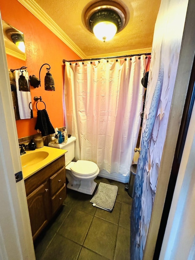 full bath featuring a textured ceiling, tile patterned flooring, toilet, vanity, and ornamental molding