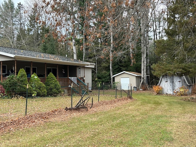 view of yard with a storage unit and covered porch