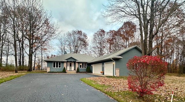 single story home with a garage