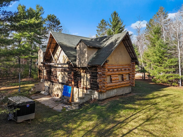 view of property exterior with a lawn