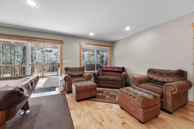 living room featuring billiards and light wood-type flooring