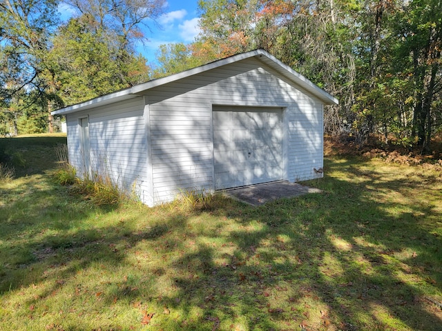 garage featuring a lawn