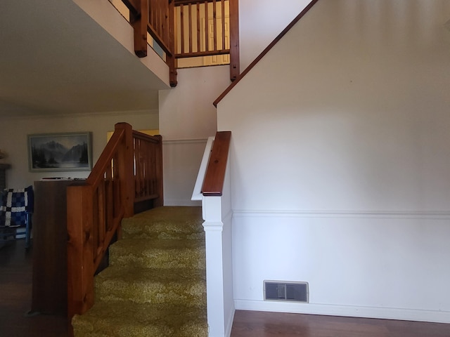 stairs with hardwood / wood-style floors