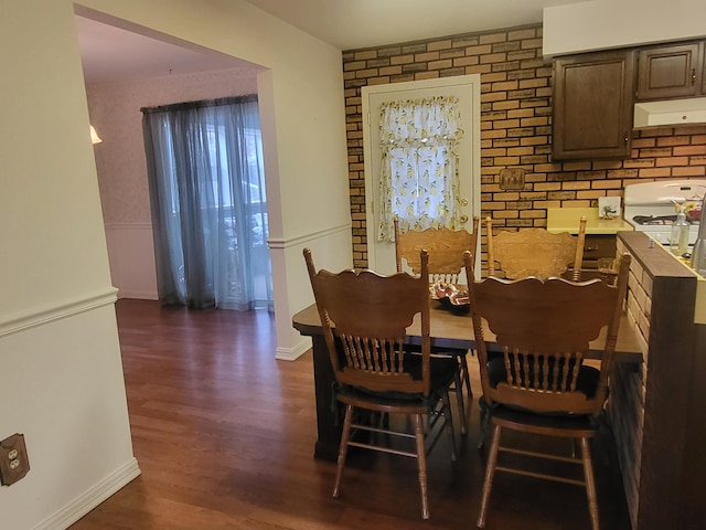 dining space with dark hardwood / wood-style floors