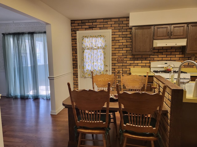 dining area featuring dark hardwood / wood-style floors