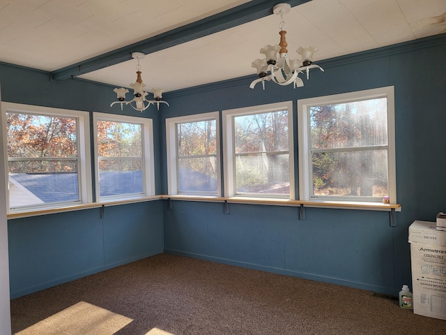 unfurnished sunroom featuring a chandelier and plenty of natural light