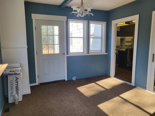 entryway with dark colored carpet, a notable chandelier, and beam ceiling