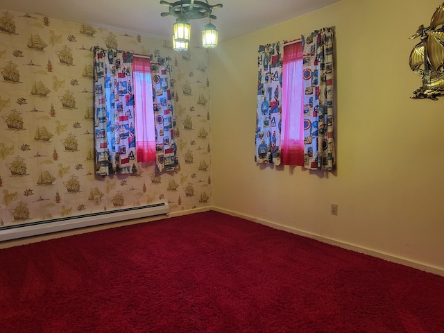 carpeted empty room with a baseboard heating unit