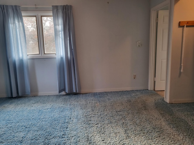 unfurnished room with carpet flooring