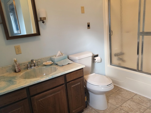 full bathroom with toilet, vanity, tile patterned flooring, and shower / bath combination with glass door