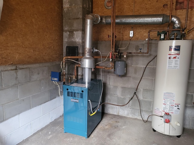 utility room featuring gas water heater