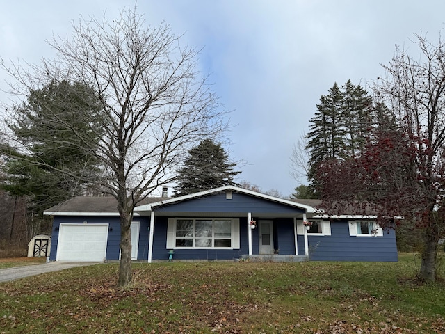 ranch-style home with a front lawn and a garage