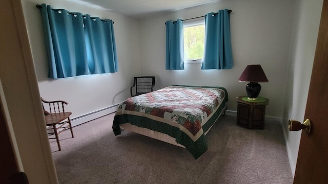 carpeted bedroom with baseboard heating