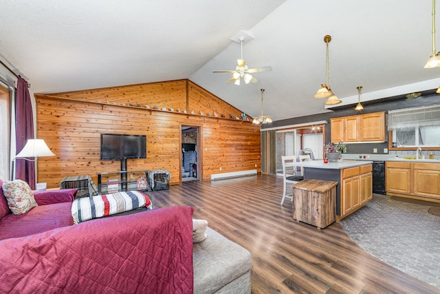 living room with sink, lofted ceiling, a baseboard heating unit, wood walls, and dark wood-type flooring