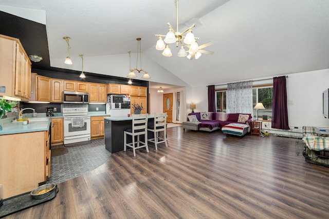 kitchen with a kitchen breakfast bar, hanging light fixtures, a kitchen island, dark hardwood / wood-style flooring, and electric range