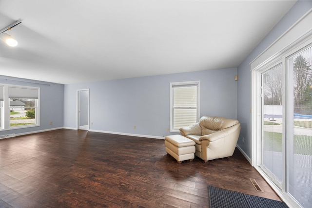 unfurnished room with dark wood-type flooring