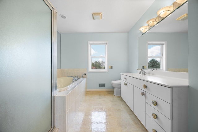 full bathroom with tile patterned floors, separate shower and tub, vanity, and toilet