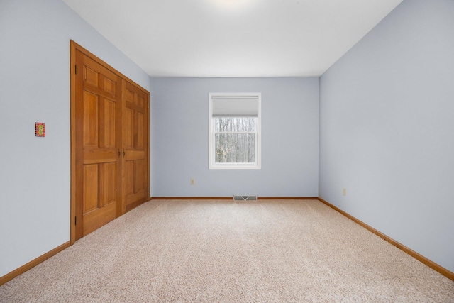 spare room with carpet flooring