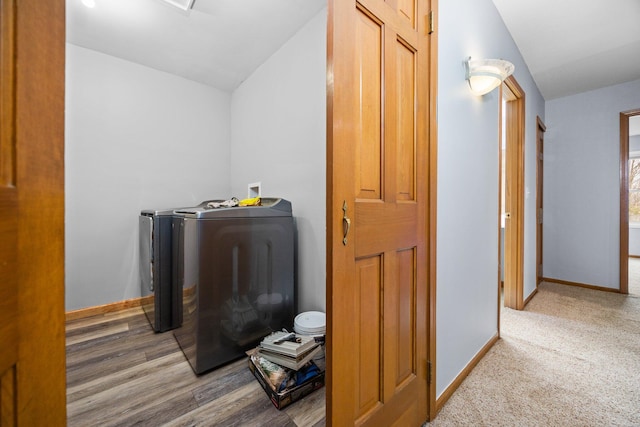 interior space featuring separate washer and dryer and hardwood / wood-style flooring