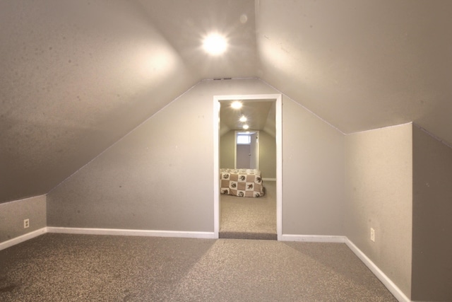 bonus room with carpet and lofted ceiling