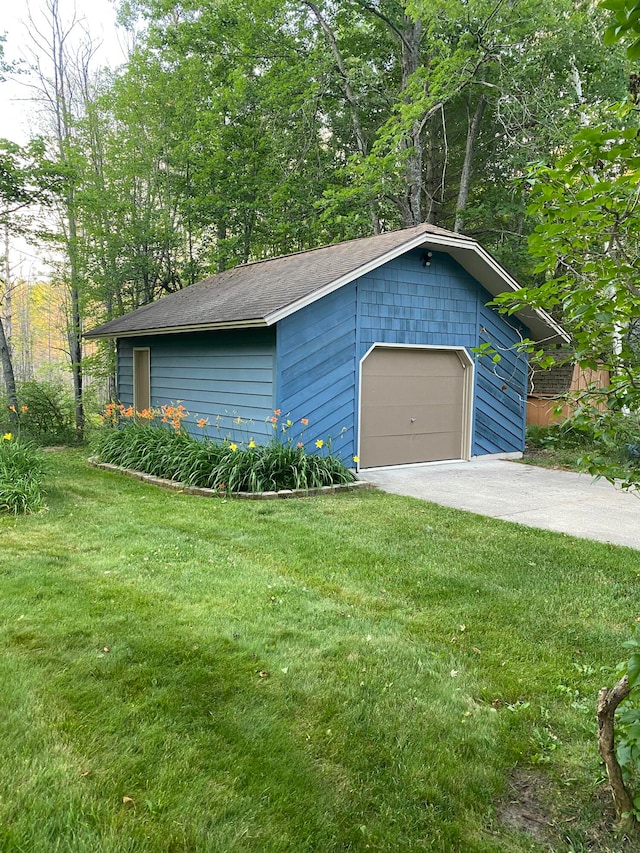 garage featuring a yard