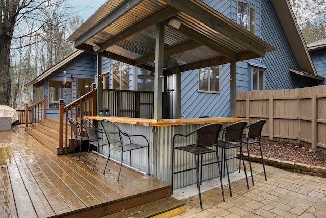 deck featuring exterior bar