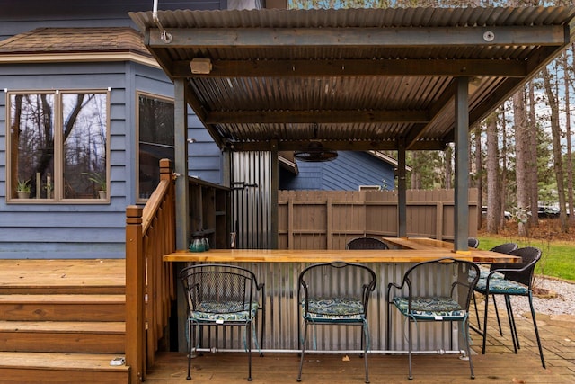 wooden deck featuring an outdoor bar