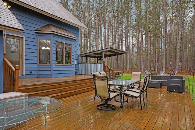 wooden deck featuring outdoor lounge area