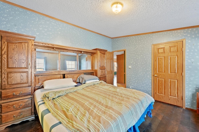 bedroom with a textured ceiling, ornamental molding, and dark wood-type flooring