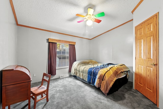 carpeted bedroom featuring ceiling fan, crown molding, and a textured ceiling