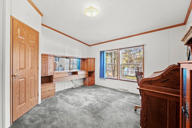 carpeted office with a textured ceiling, vaulted ceiling, and crown molding