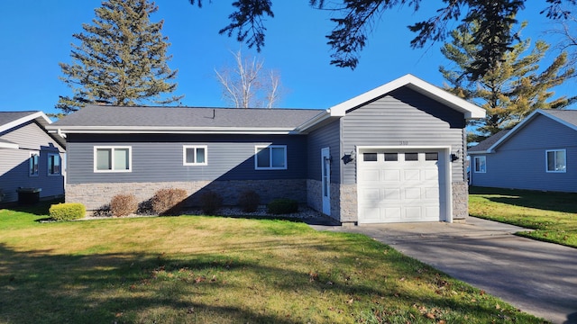 exterior space featuring a front lawn and a garage