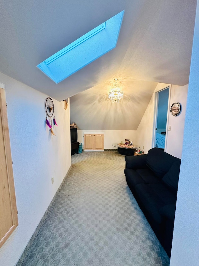 bonus room featuring vaulted ceiling with skylight, a chandelier, and carpet flooring