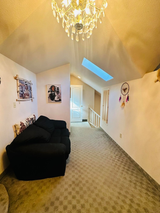 living area featuring lofted ceiling with skylight, carpet, and a textured ceiling