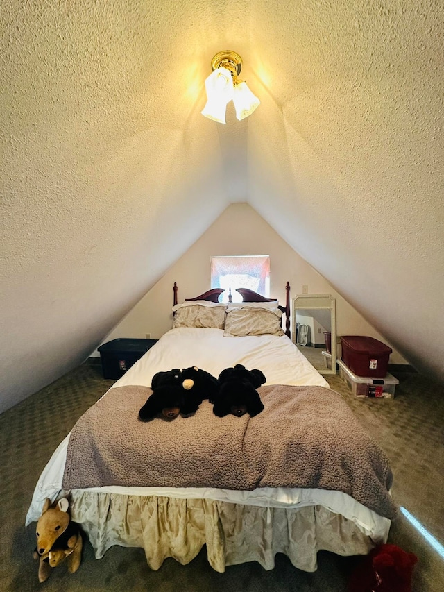 bedroom with a textured ceiling, vaulted ceiling, and carpet