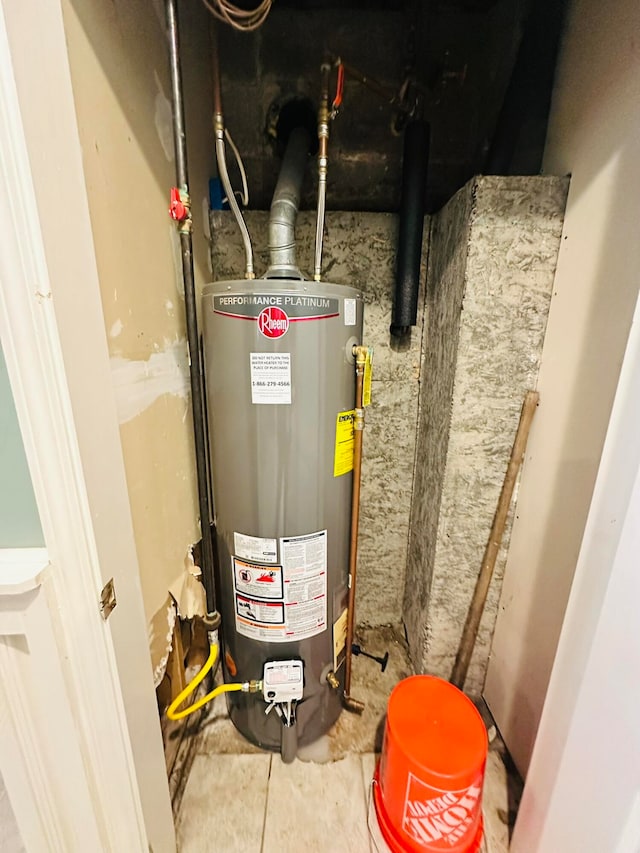 utility room featuring water heater