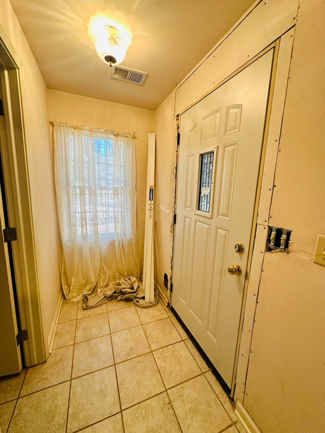 entryway featuring light tile patterned flooring