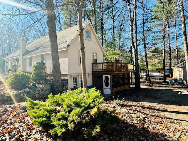 view of side of home featuring a deck