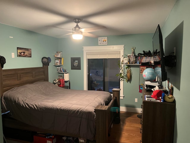 bedroom featuring wood-type flooring and ceiling fan